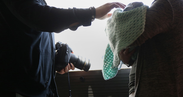 Photographer Shane Epping poses Courteney Grimm for a photo shoot with her nephew, Kyson. Photo / The Washington Post photo by Timothy Tai